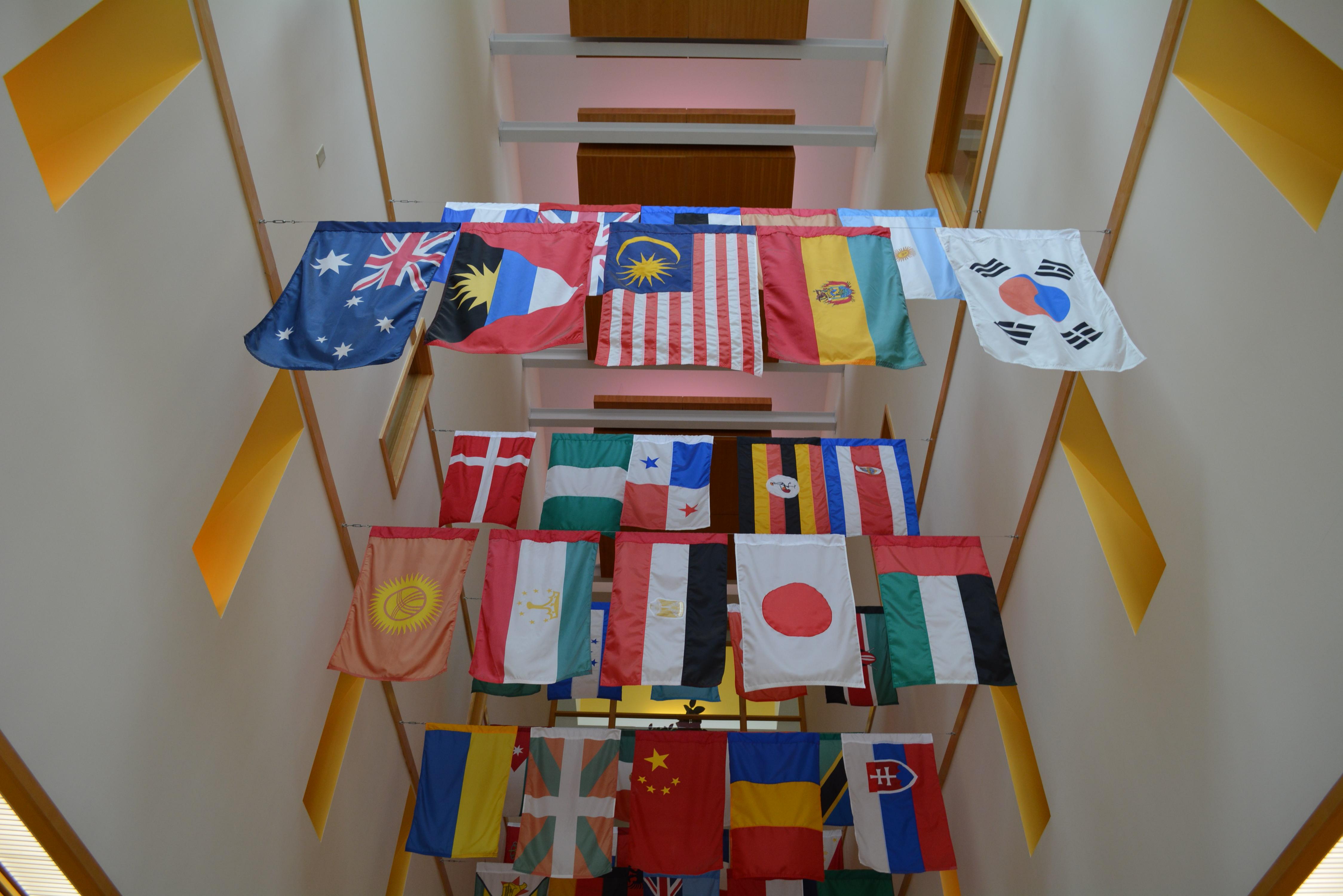 World flags hanging in a hallway